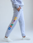 Gray sweatpants with colorful text on a white background