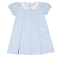 Light blue dress with white collar and pleats