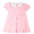 Pink cord dress with white peter pan collar, short sleeves and pleats